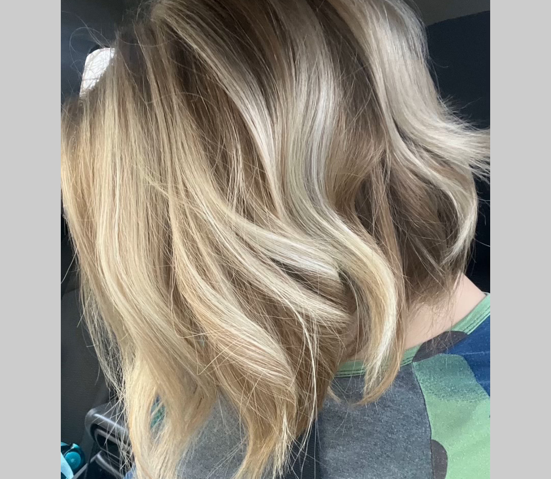 Side-view of a short, blonde, pretty hair style. This is an after pic.