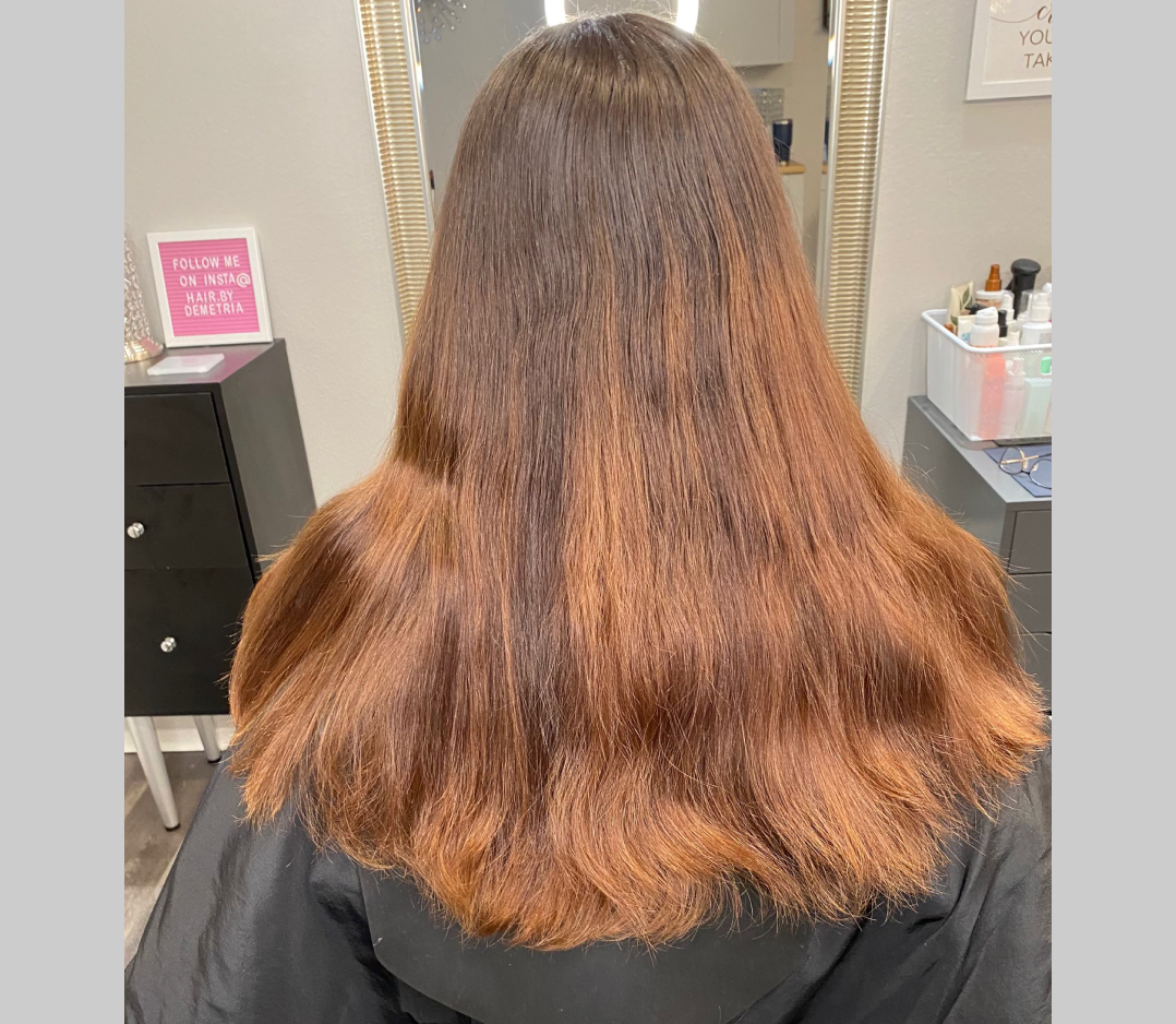Before picture of a woman with brassy pinky hair.