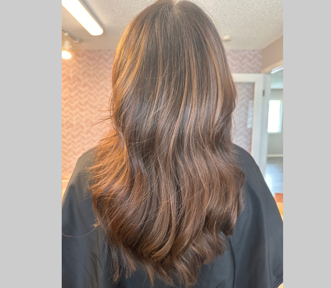 After picture of a woman with long brown smooth wavy hair. 