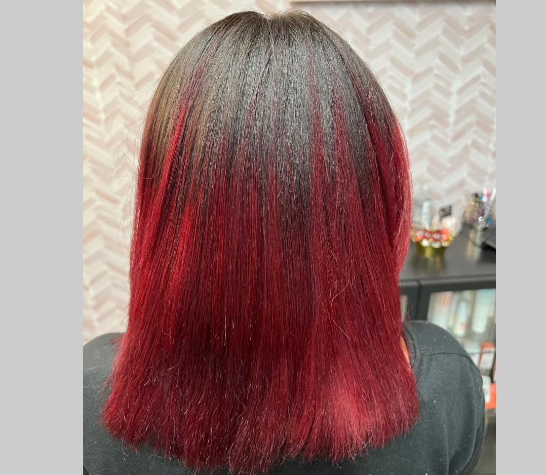 Smooth flat shiny black hair that has pretty red long smooth ends.