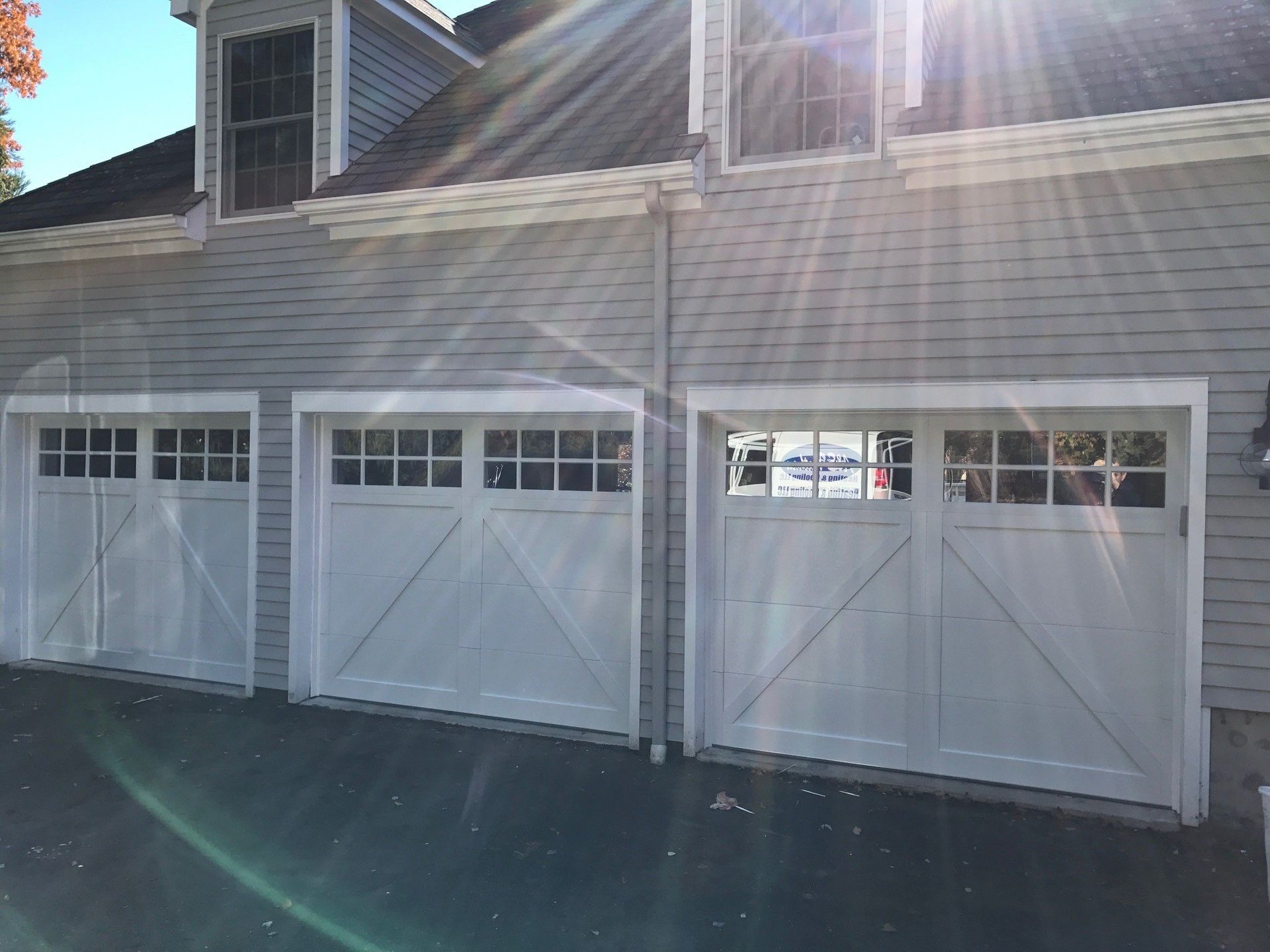 three white barn door style garage doors