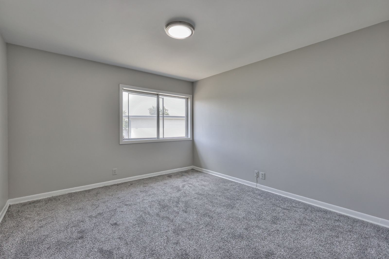 Photo of a carpeted bedroom