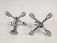 Two shiny metal faucet handles, one side view and one front view, on a white background