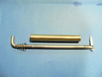 Brass tubular instrument with a curved metal rod and coil springs on a blue background