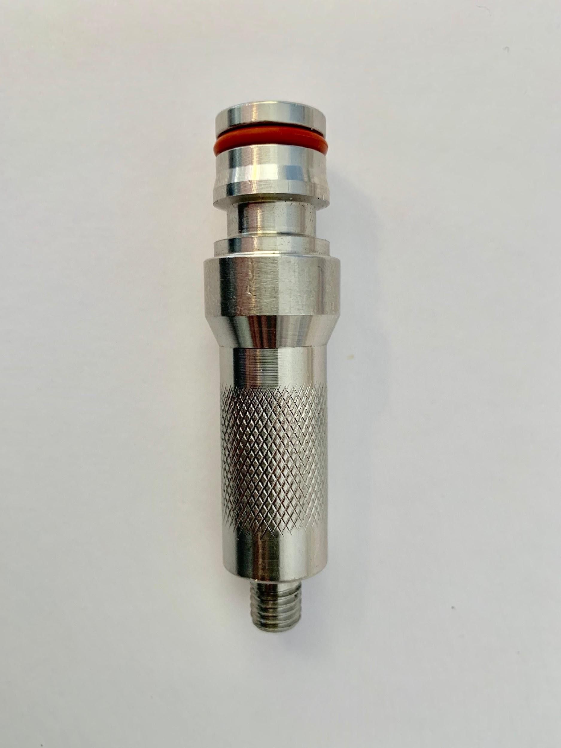 Metal pneumatic quick-connect fitting with red O-ring on a white background