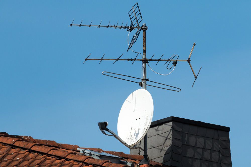 Satellite And TV Antennas On The Red Roof — Townsville Electrical and Appliance Repairs In Aitkenvale, QLD