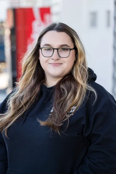 Portrait of a woman with long hair | Expert Auto Service & Licensing