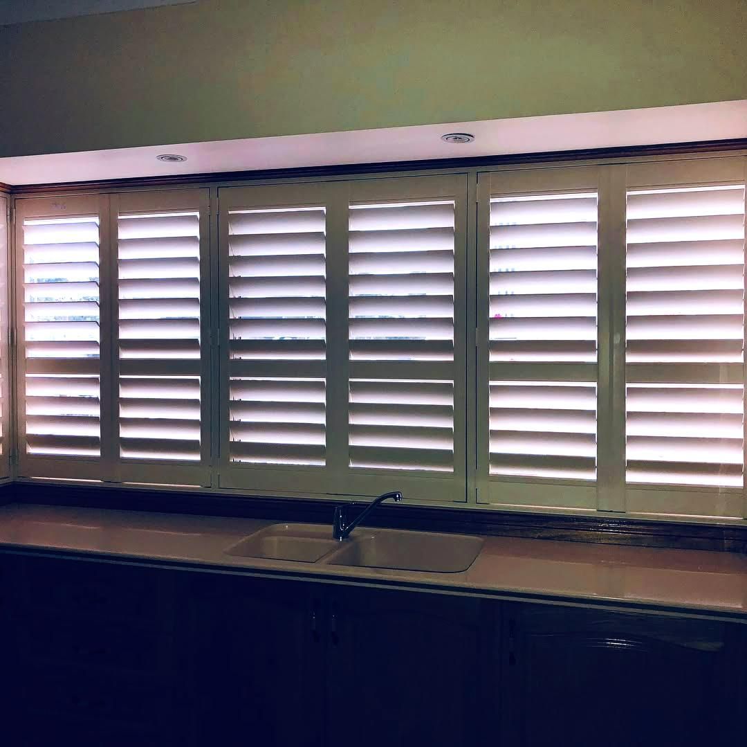 White Interior Shutters Over Kitchen Sink — JSF Interiors Goulburn in Moss Vale, NSW