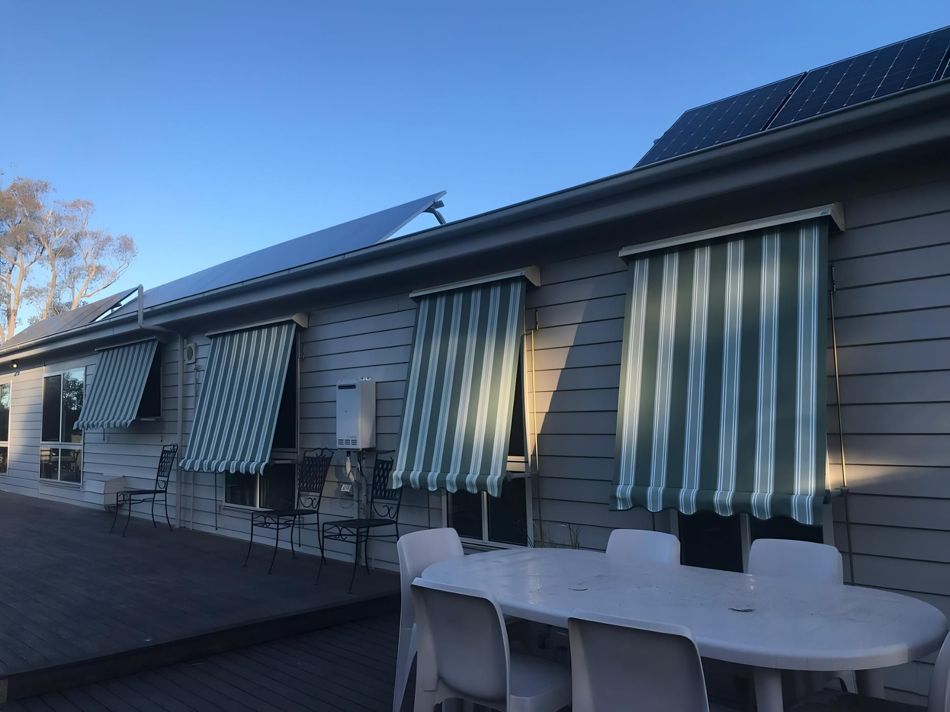 House With Striped Green Awnings And Wooden Deck — JSF Interiors Goulburn in Goulburn, NSW