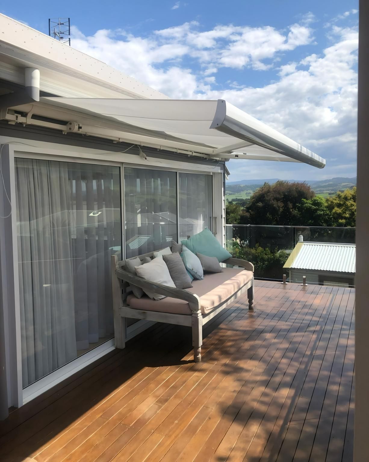 Outdoor Deck With Seating Under Awning And Scenic View — JSF Interiors Goulburn in Goulburn, NSW