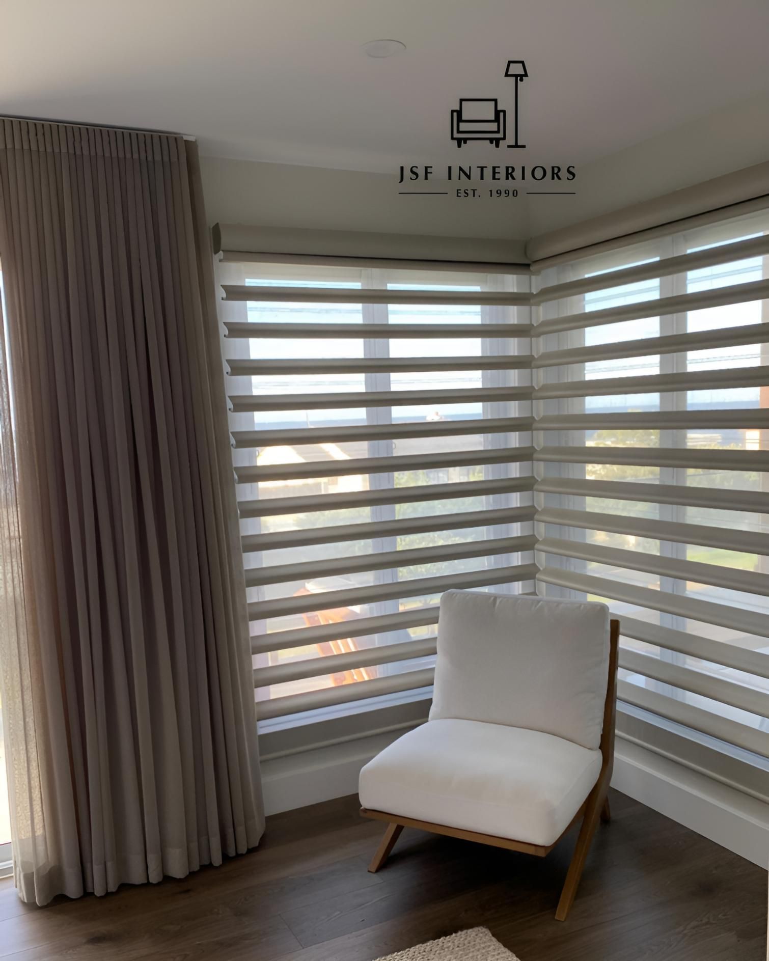 Corner Room With Chair Zebra Blinds And Neutral Curtains — JSF Interiors Goulburn in Dapto, NSW