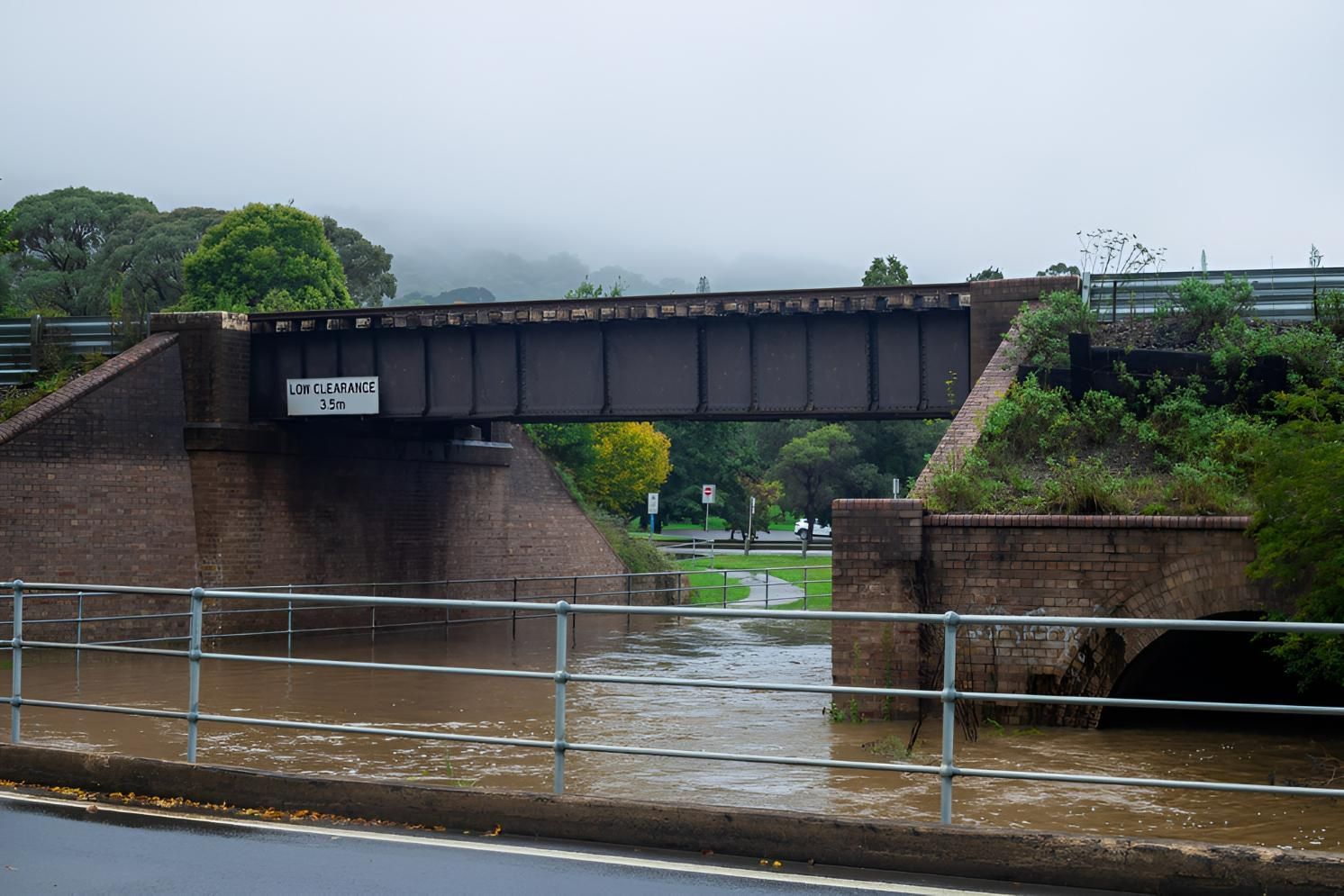 Railway Bridge Over Flooded Creek With Brick Supports — JSF Interiors Goulburn in Mittagong, NSW