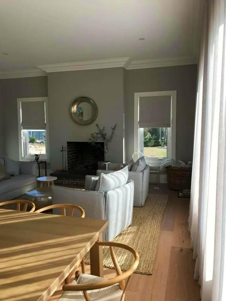 Living Room With Fireplace And Light Furniture — JSF Interiors Goulburn in Goulburn, NSW