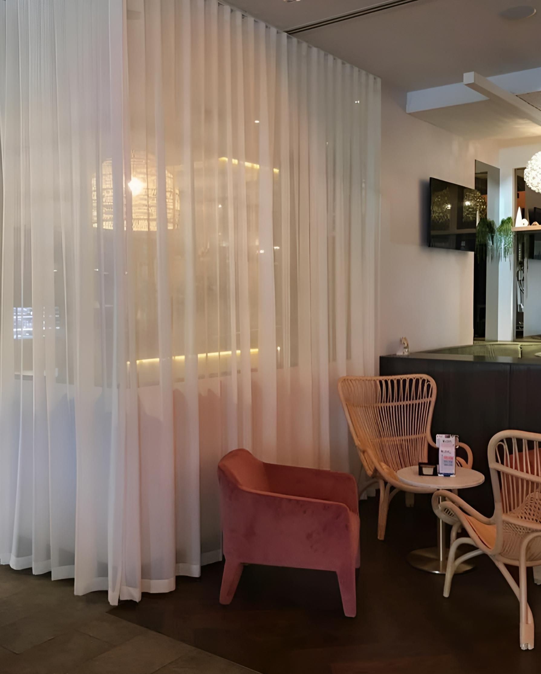 Room Interior With Sheer White Curtains, Pink Armchair, And Rattan Chairs — JSF Interiors Goulburn in Mittagong, NSW