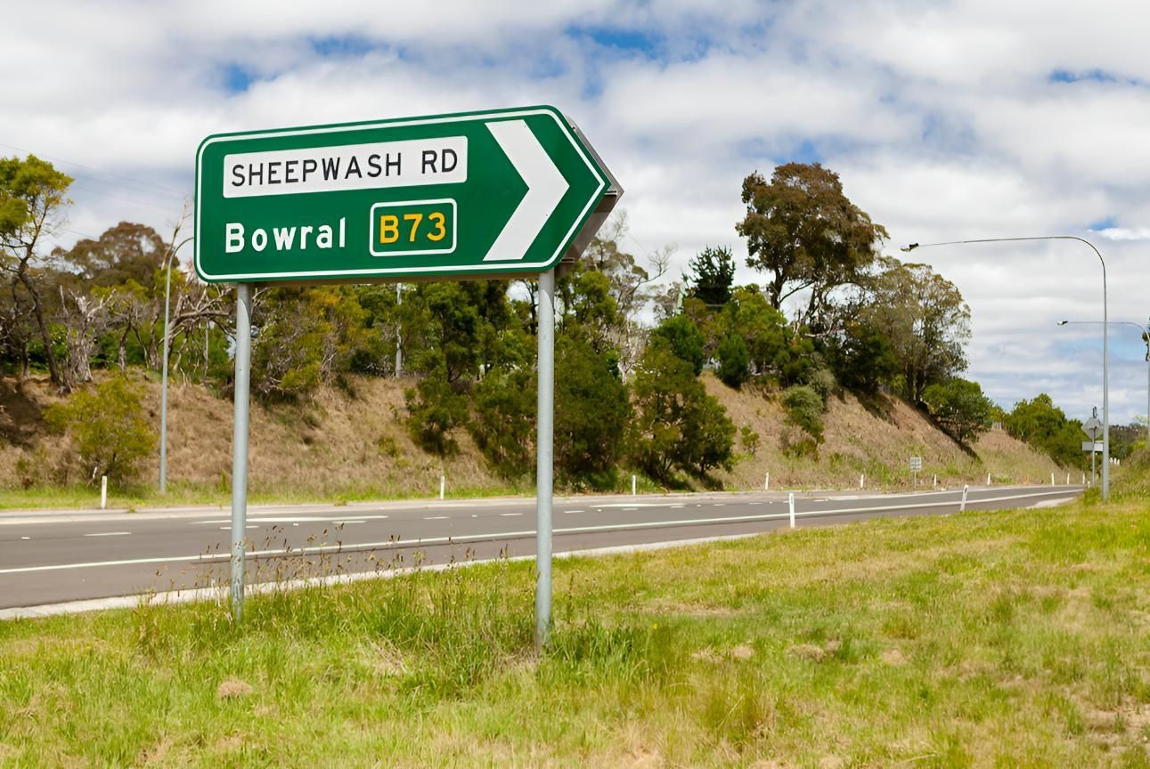 Green Road Sign Indicating Sheepwash Rd To Bowral — JSF Interiors Goulburn in Bowral, NSW