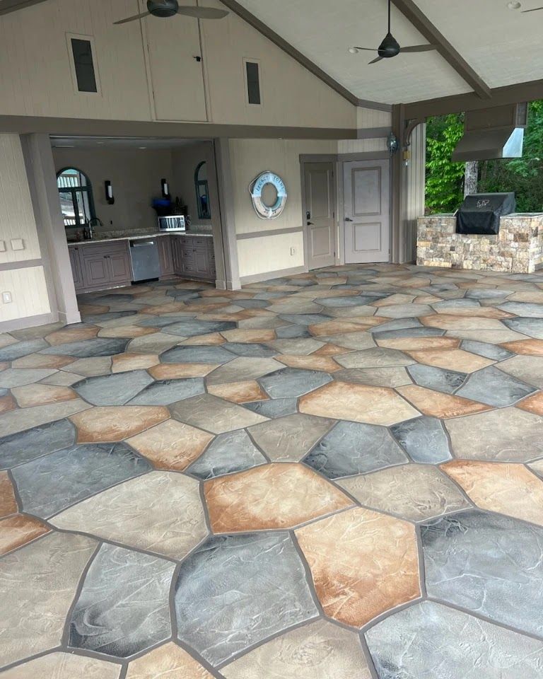 Detailed view of a stamped concrete patio versus stone pavers