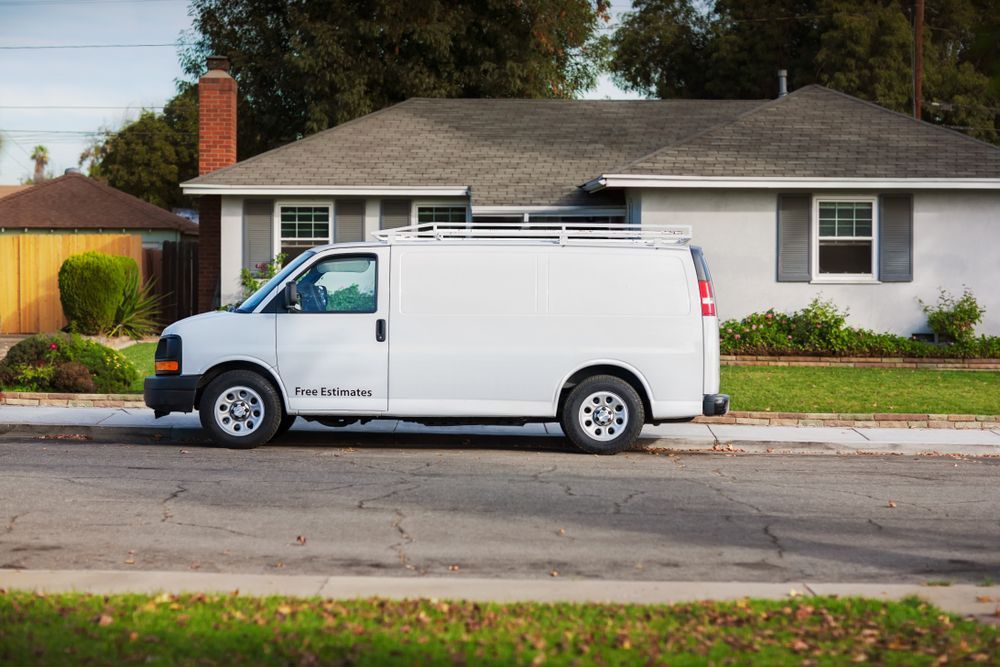 White Work Van Parked on the Street — Mid Coast Smash Repairs In Tuncurry, NSW