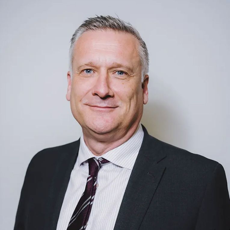 Confident James Stevens, with years of nursing and healthcare management expertise, dressed in business attire. Confident James Stevens, with years of nursing and healthcare management expertise, dressed in business attire.