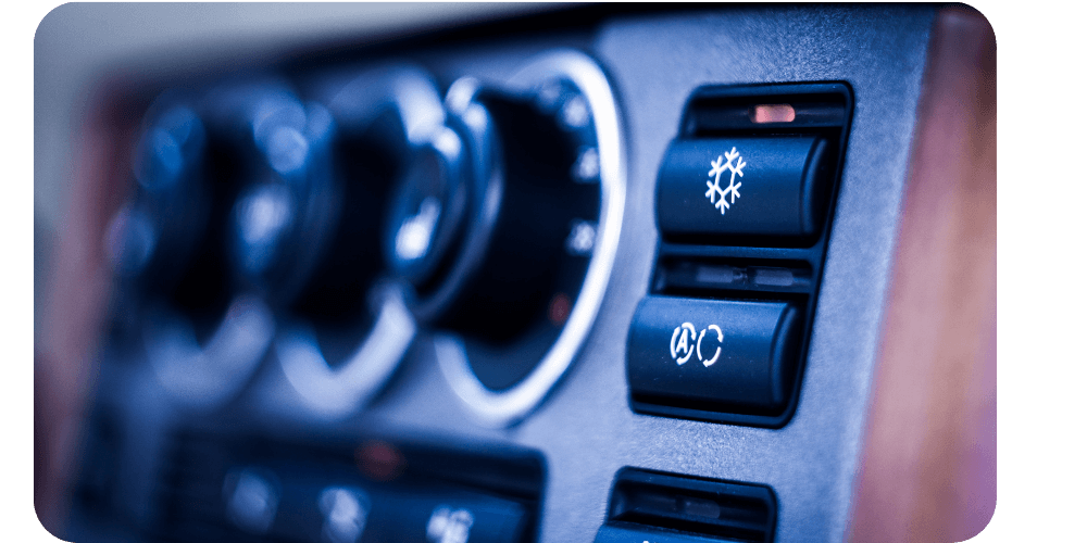 Dashboard controls with two buttons showing snowflake and fan symbols, indicating climate control.