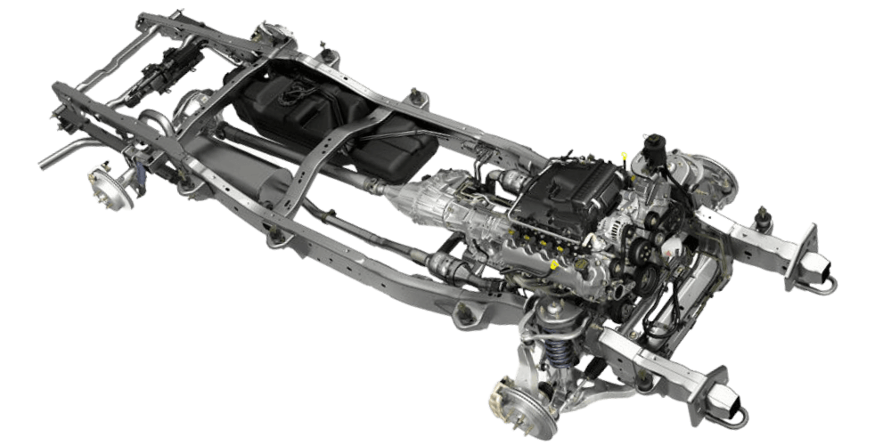 Truck chassis with engine and drivetrain components visible.
