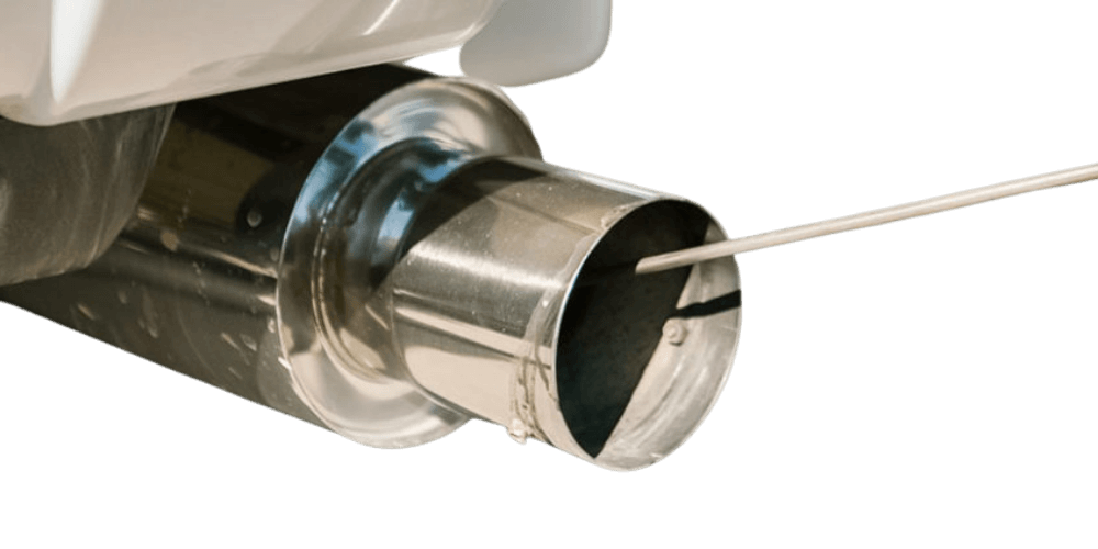 A metal exhaust pipe with a wire being inserted into it.
