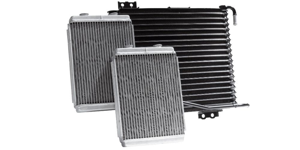 Radiators of various sizes, with a corrugated design, and in black and silver.