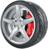 Silver car wheel with red brake caliper. Black tire reads