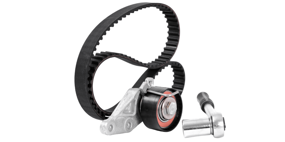 Timing belt and tensioner assembly for an engine.