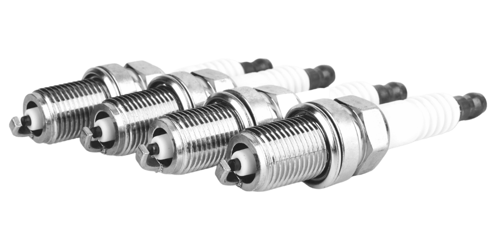 Four spark plugs in a row, angled slightly.