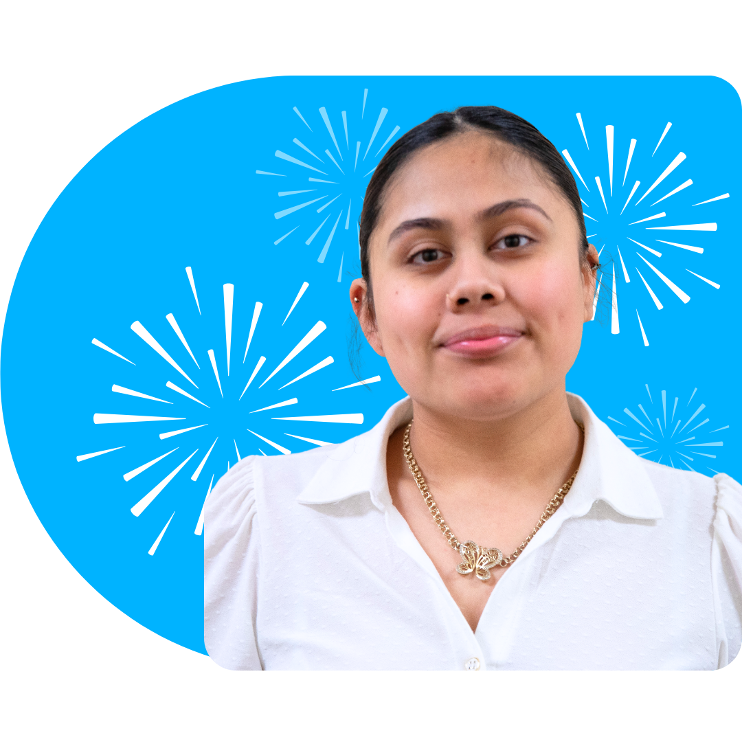 A person smiling, wearing a white blazer against a bright blue background featuring white, stylized firework illustrations.