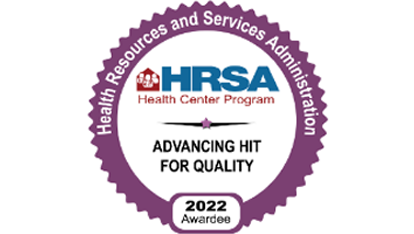 A circular purple badge reading 