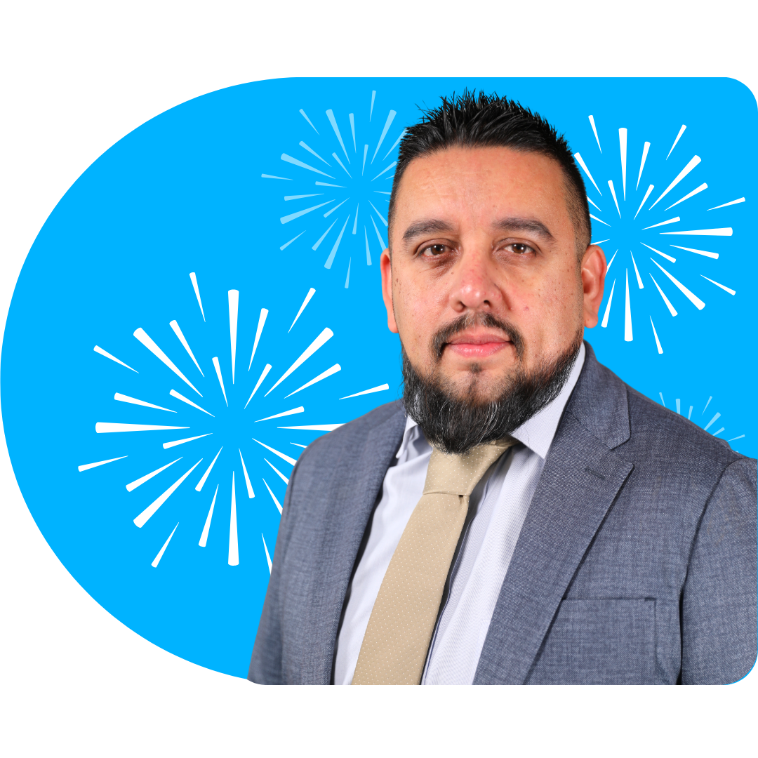 A person smiling, wearing a white blazer against a bright blue background featuring white, stylized firework illustrations.