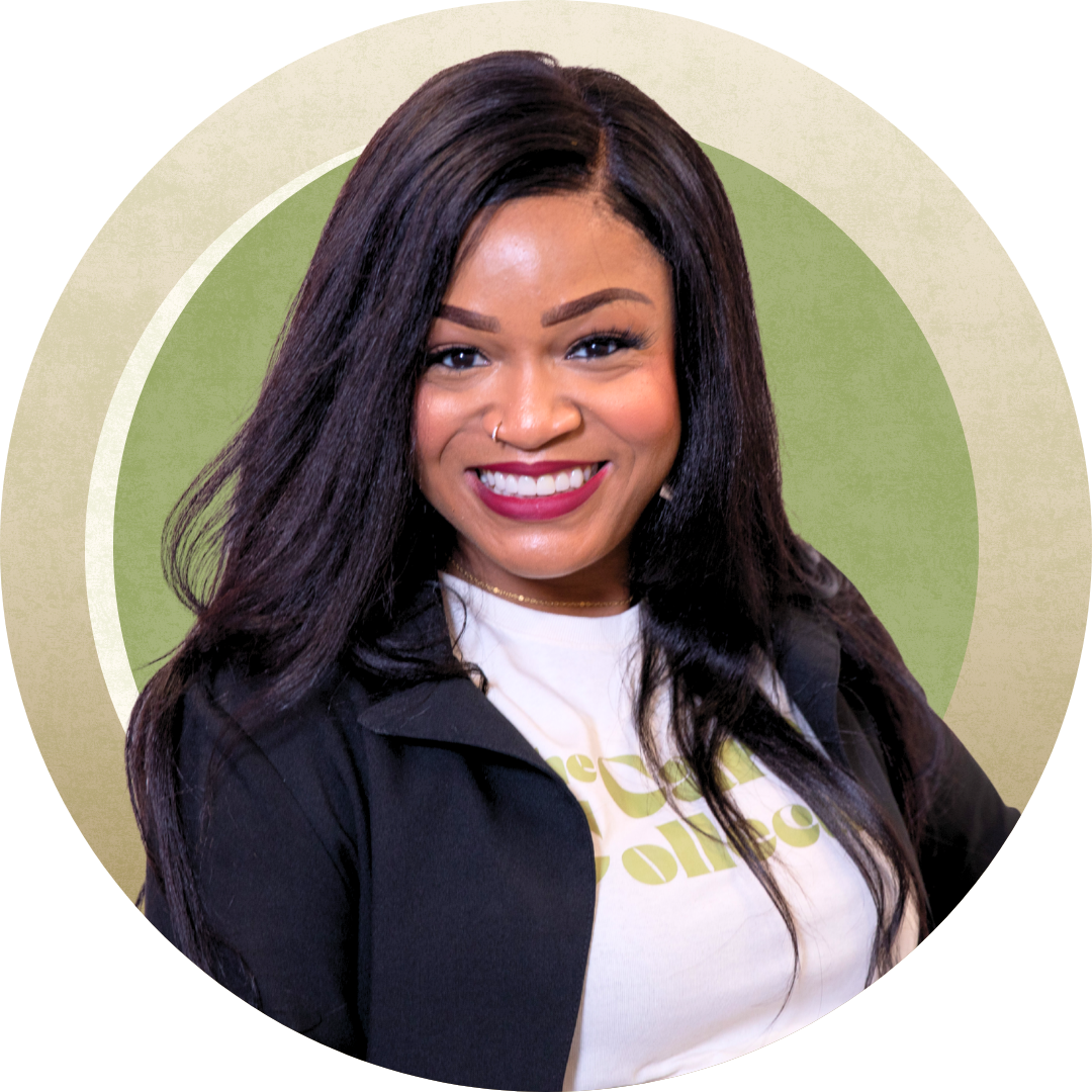 A professional portrait of a smiling person with dark hair, wearing a white shirt under a black jacket against a green background.