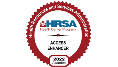 A circular seal for the 2022 HRSA Health Center Program Access Enhancer award with red, white, and blue text and graphics.