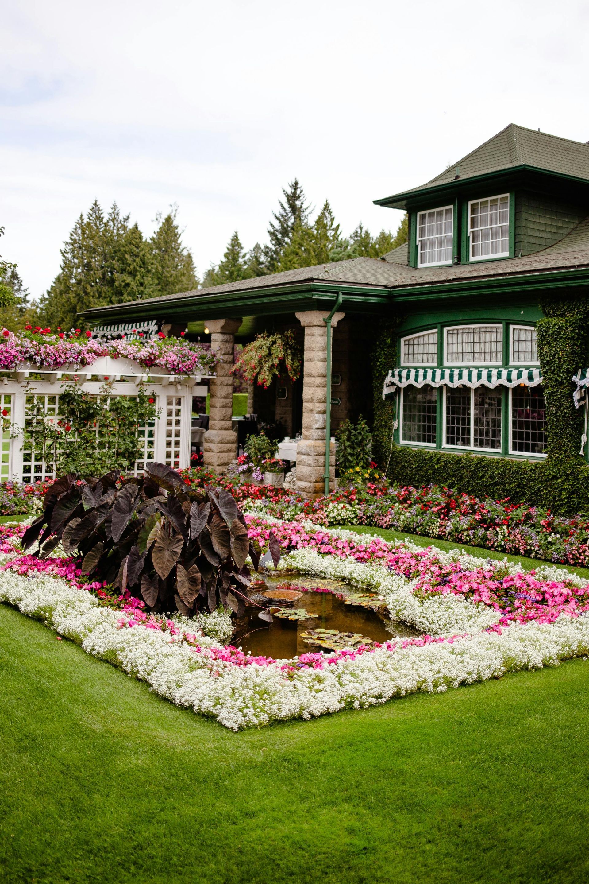 A large house with a garden in front of it