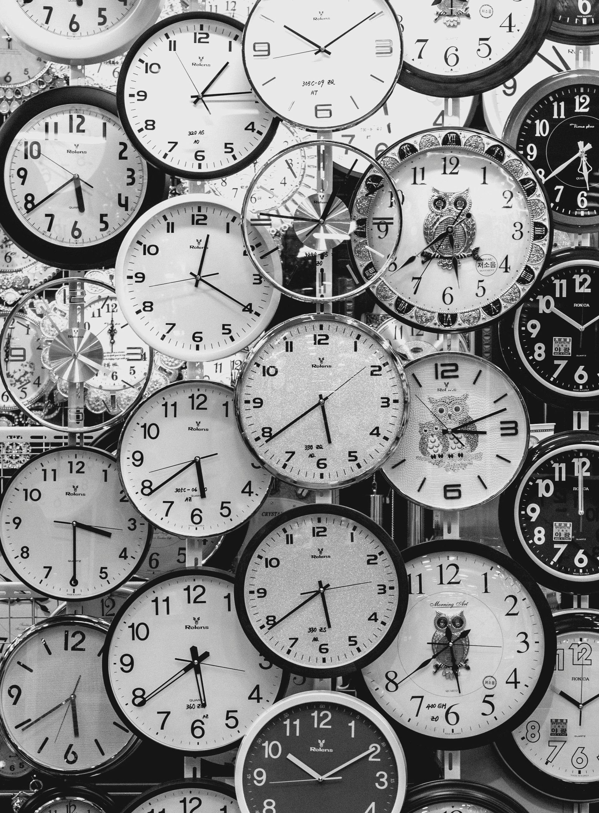 A bunch of clocks are stacked on top of each other