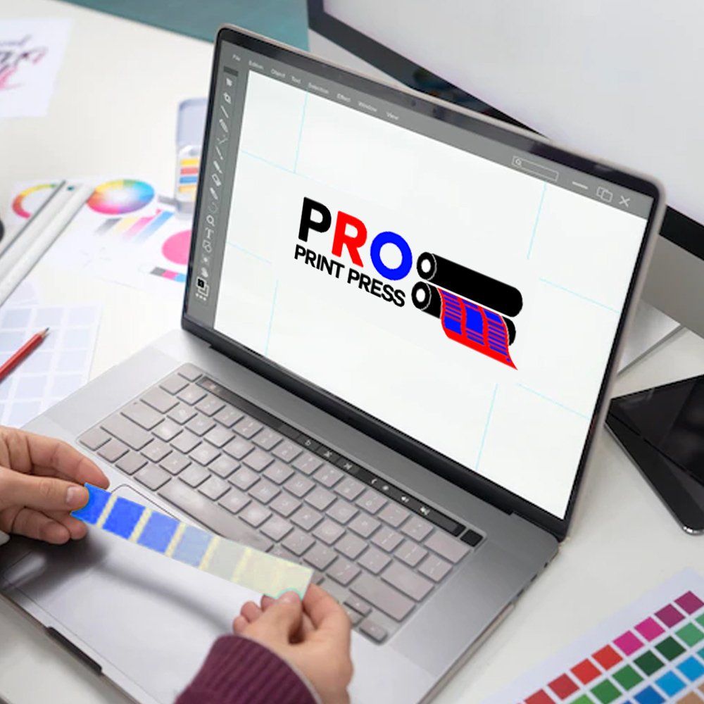 A professional designing a logo using a computer. A professional designing a logo using a computer.