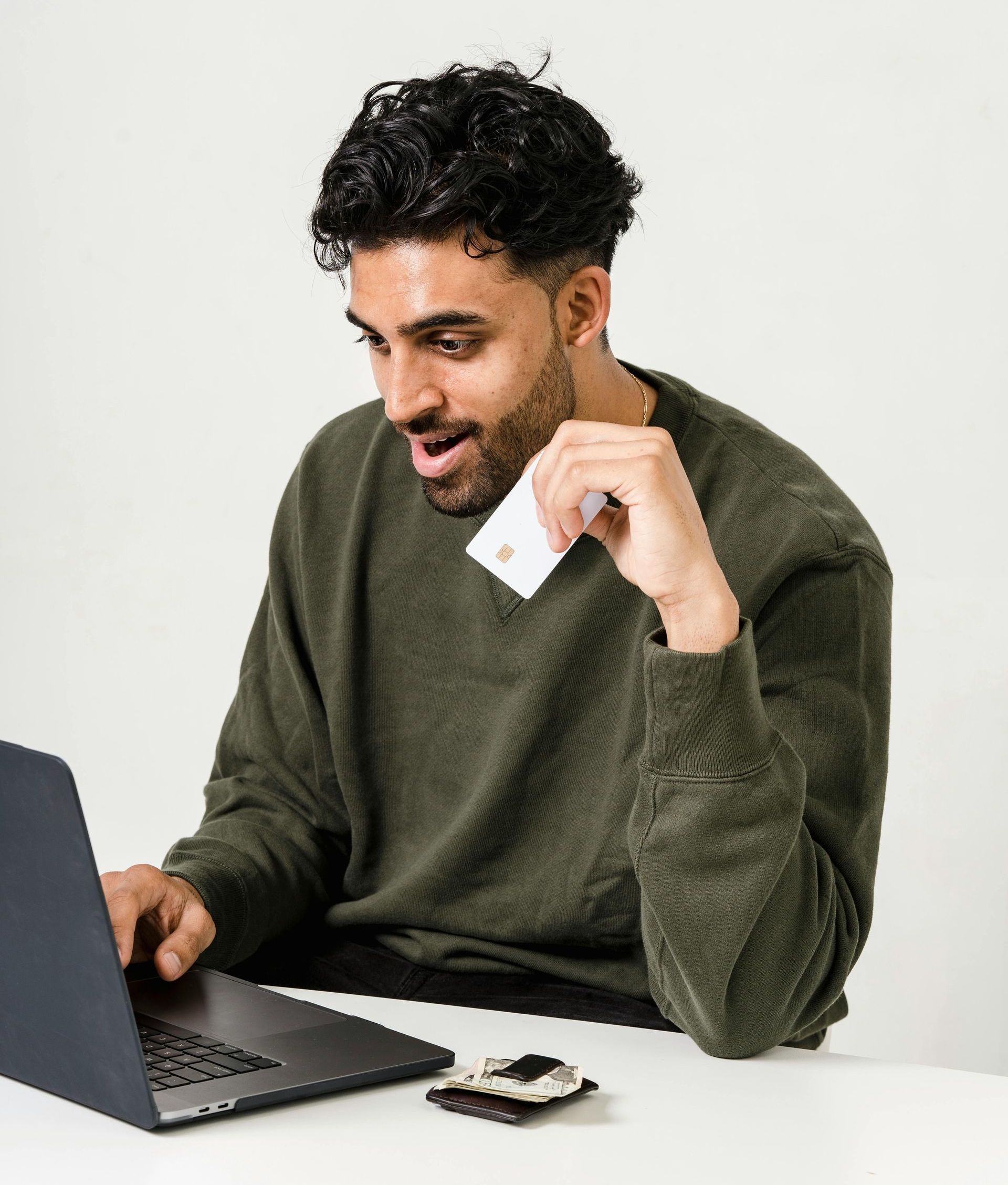 A person sitting at a desk, looking impressed while viewing a computer screen, conveying trust and authority. A person sitting at a desk, looking impressed while viewing a computer screen, conveying trust and authority.