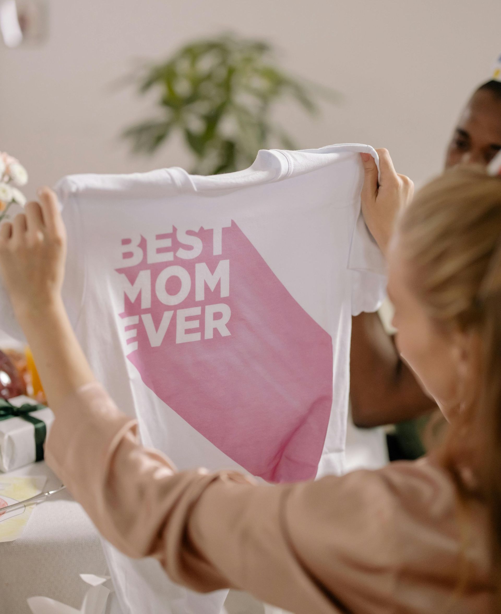 Person holding up a custom printed t-shirt