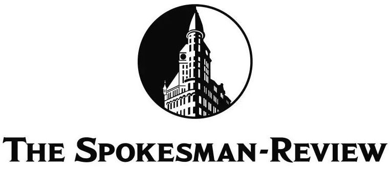 A black and white logo for the spokesman review