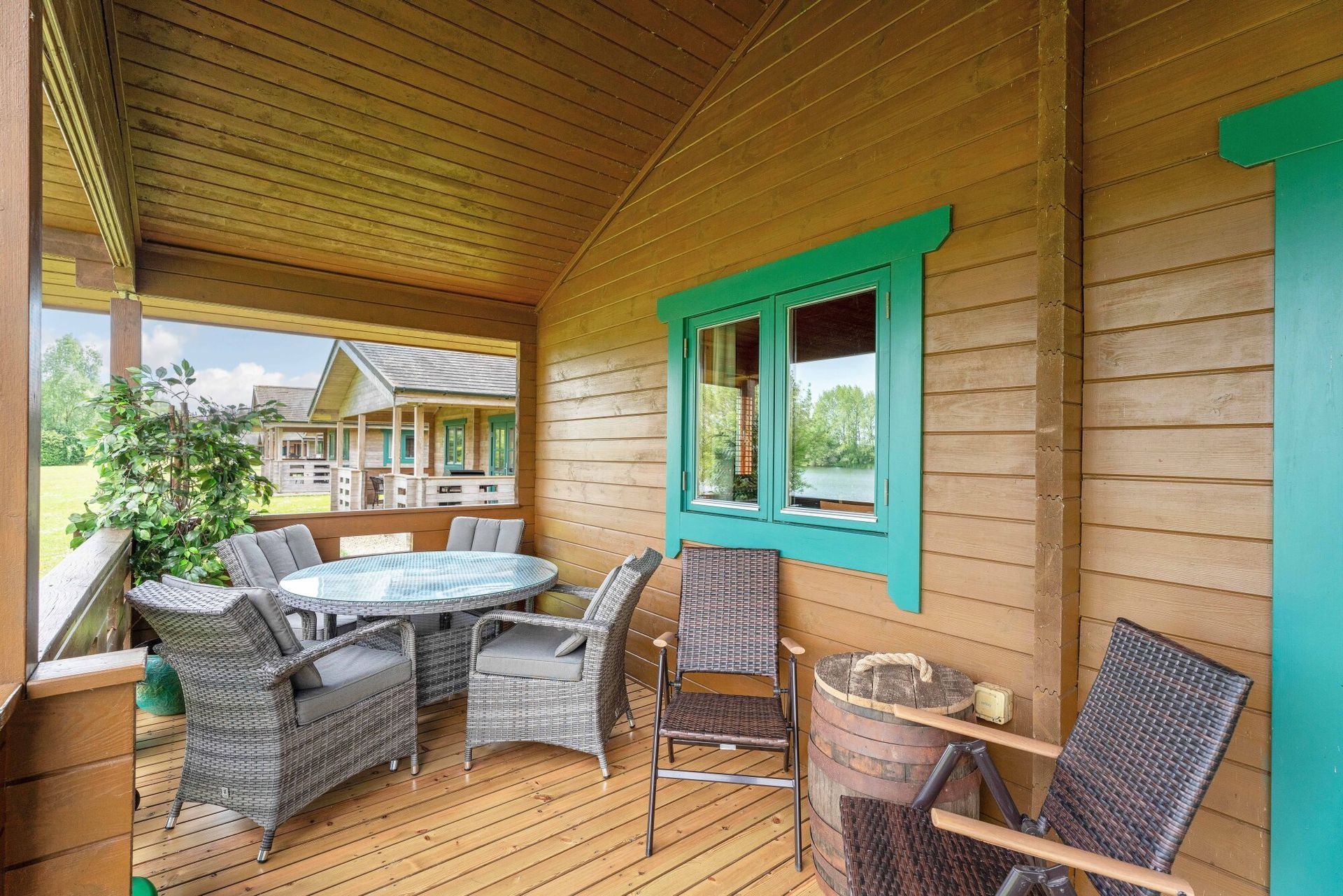 Covered veranda with outdoor seating at Lodge 5 Heron