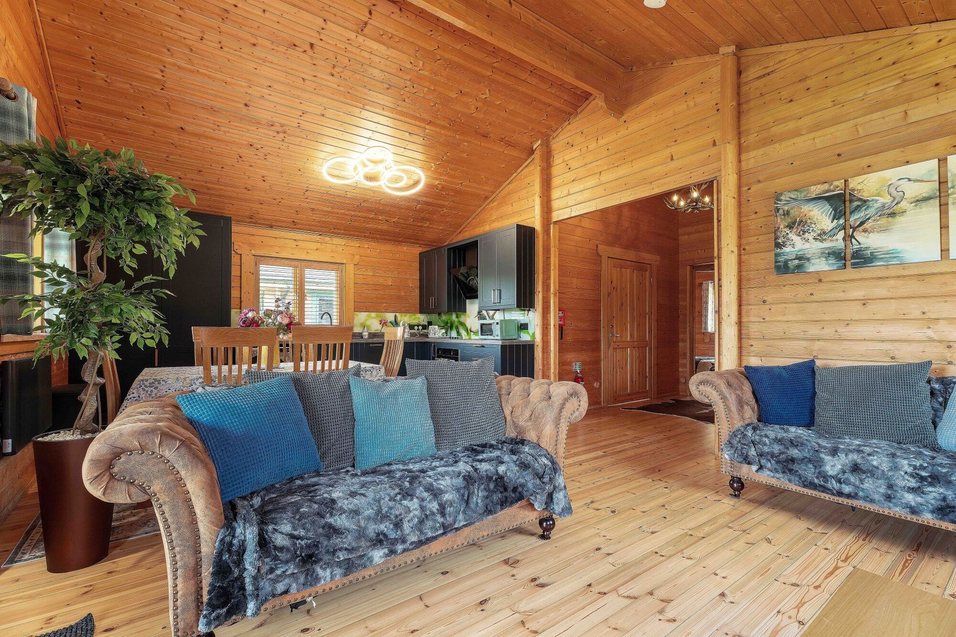 Spacious open-plan living and dining area at Lodge 5 Heron