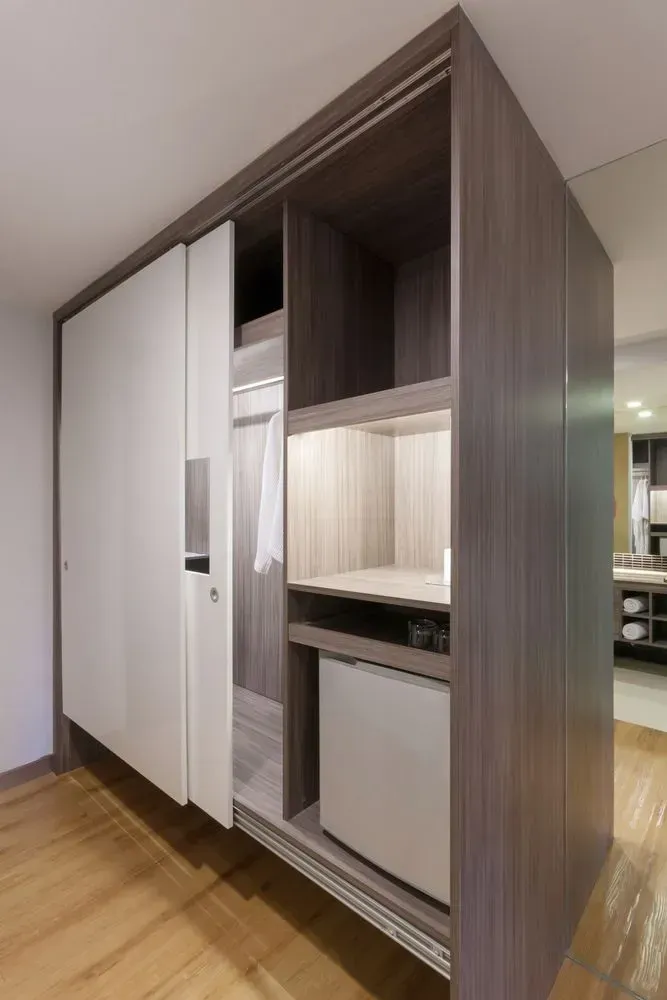 A Closet with Sliding Doors and A Refrigerator Inside of It — Lock & Door in Albury, NSW