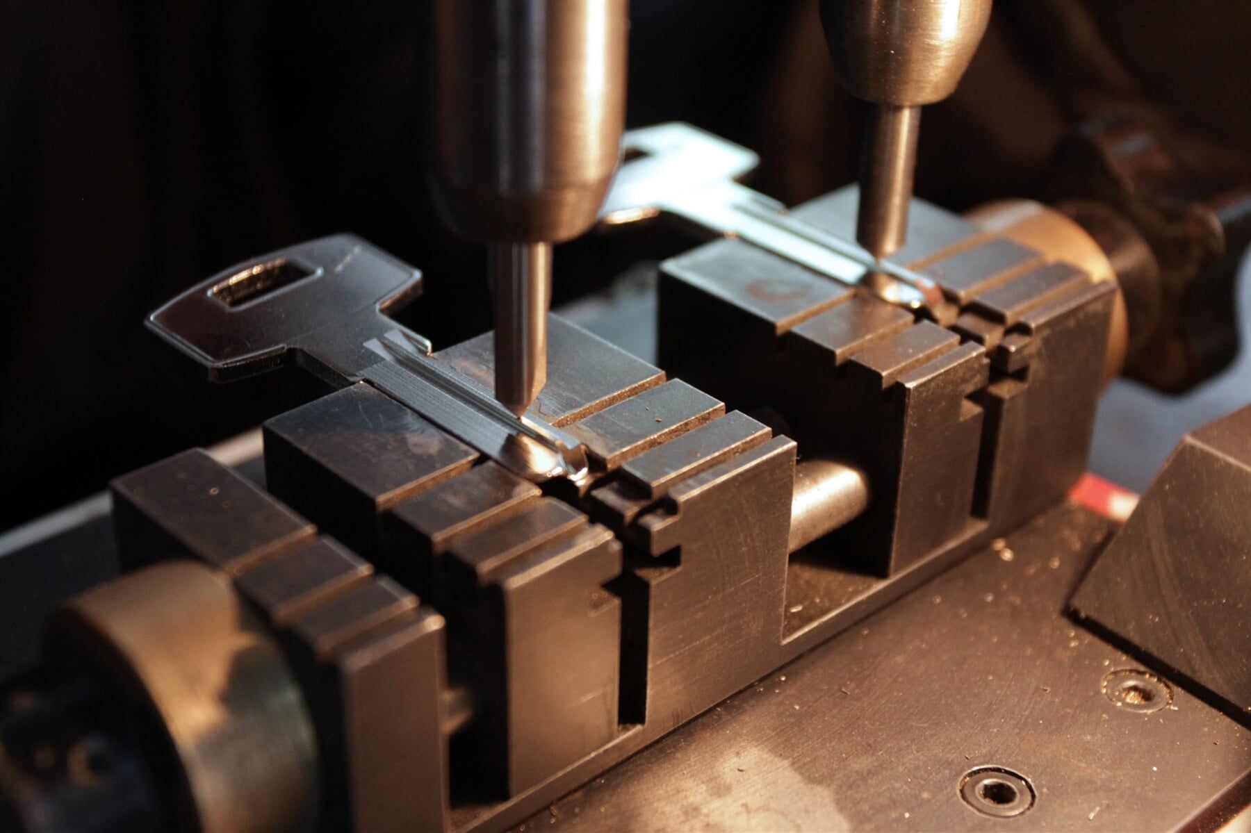 A Machine Is Cutting a Key Into a Piece of Metal — Lock & Door in Wodonga, VIC