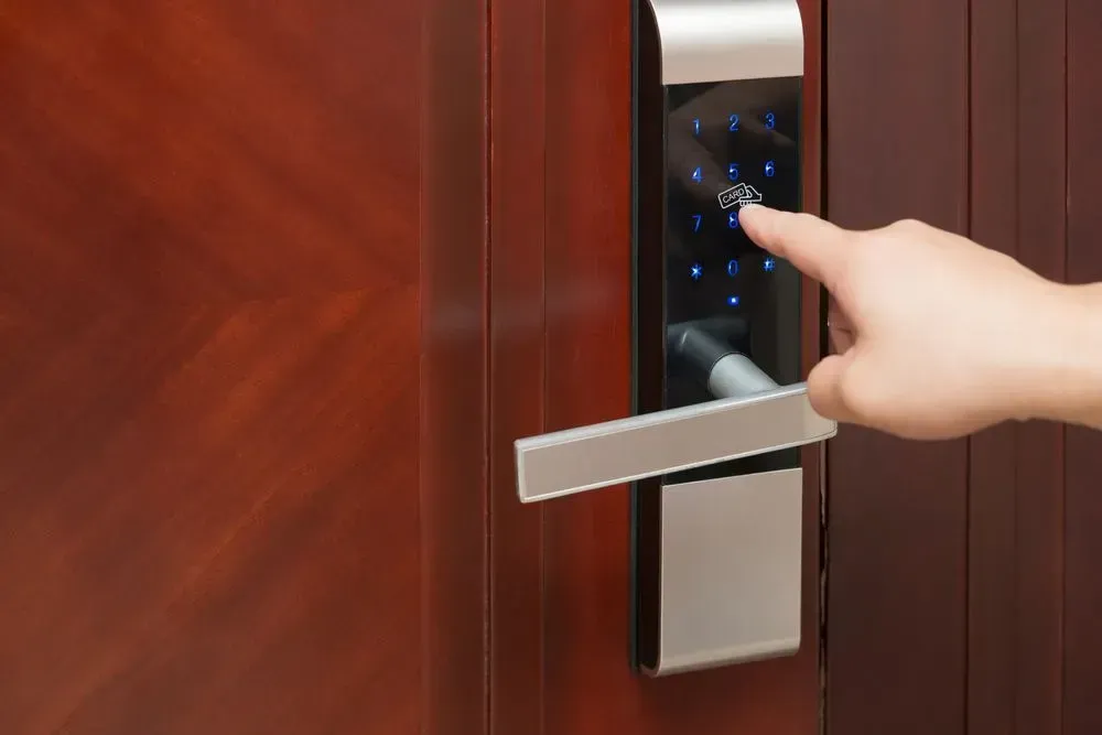A Person Is Pressing a Button on A Digital Door Lock — Lock & Door in Wodonga, VIC