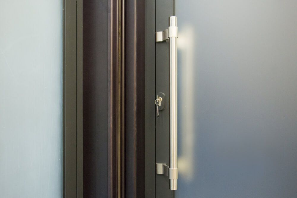 A Close up Of a Door with A Handle and A Key — Lock & Door in Wodonga, VIC