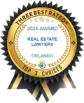 Gold award badge with black ribbons, reading “2024 Award Real Estate Lawyers Orlando” and “Top 3 Choices”