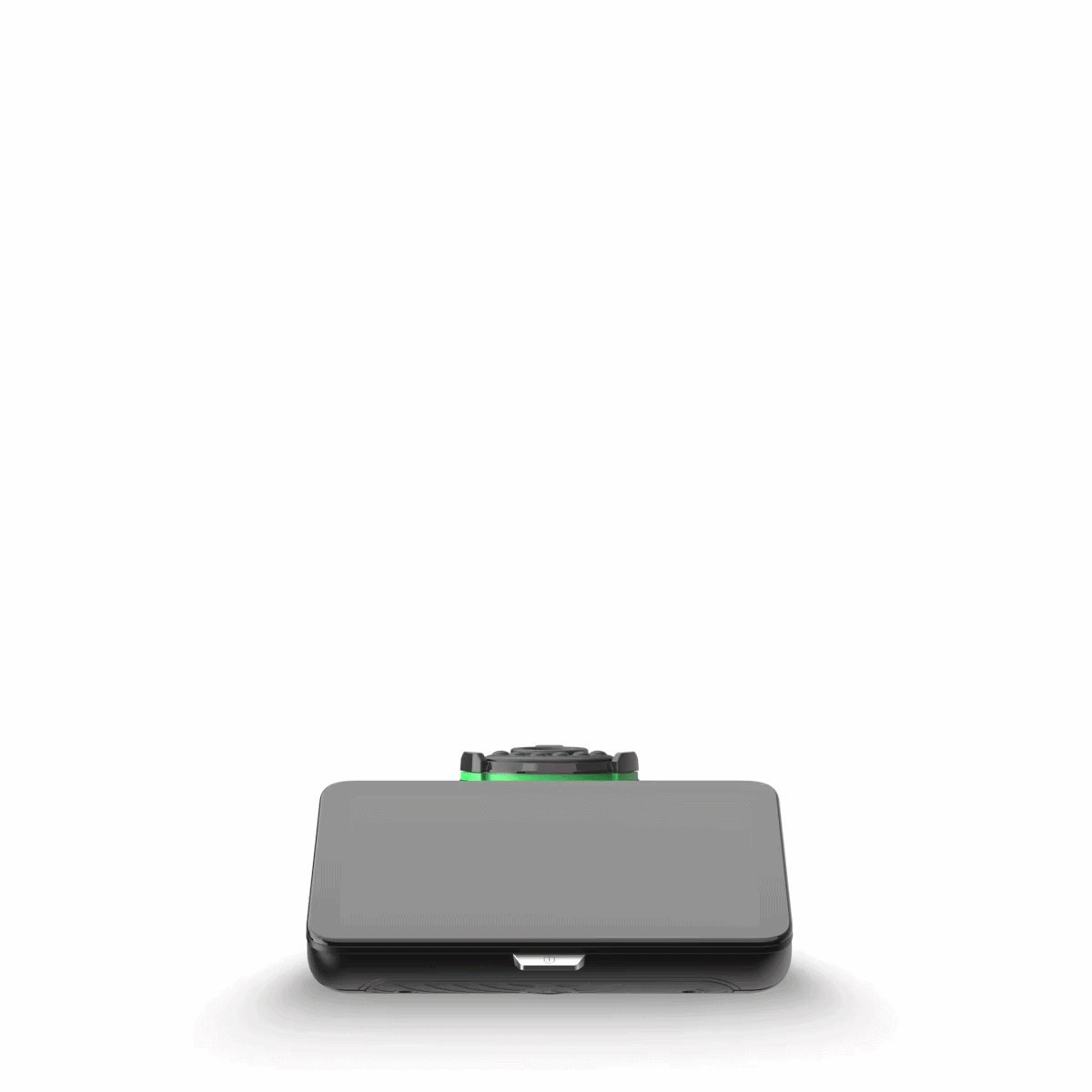 Dispositivo compatto grigio e nero con un piccolo dettaglio sulla parte superiore, centrato su sfondo bianco.