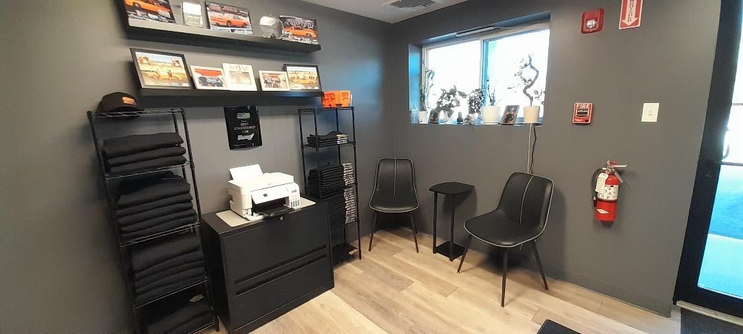 A waiting room with a fire extinguisher on the wall.