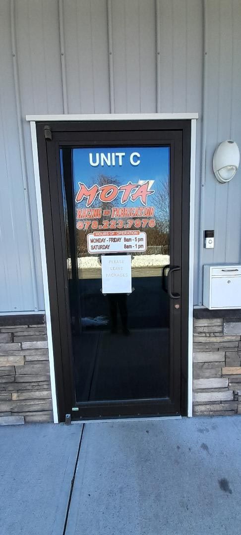 A door with a sign on it that says `` unit c ''.